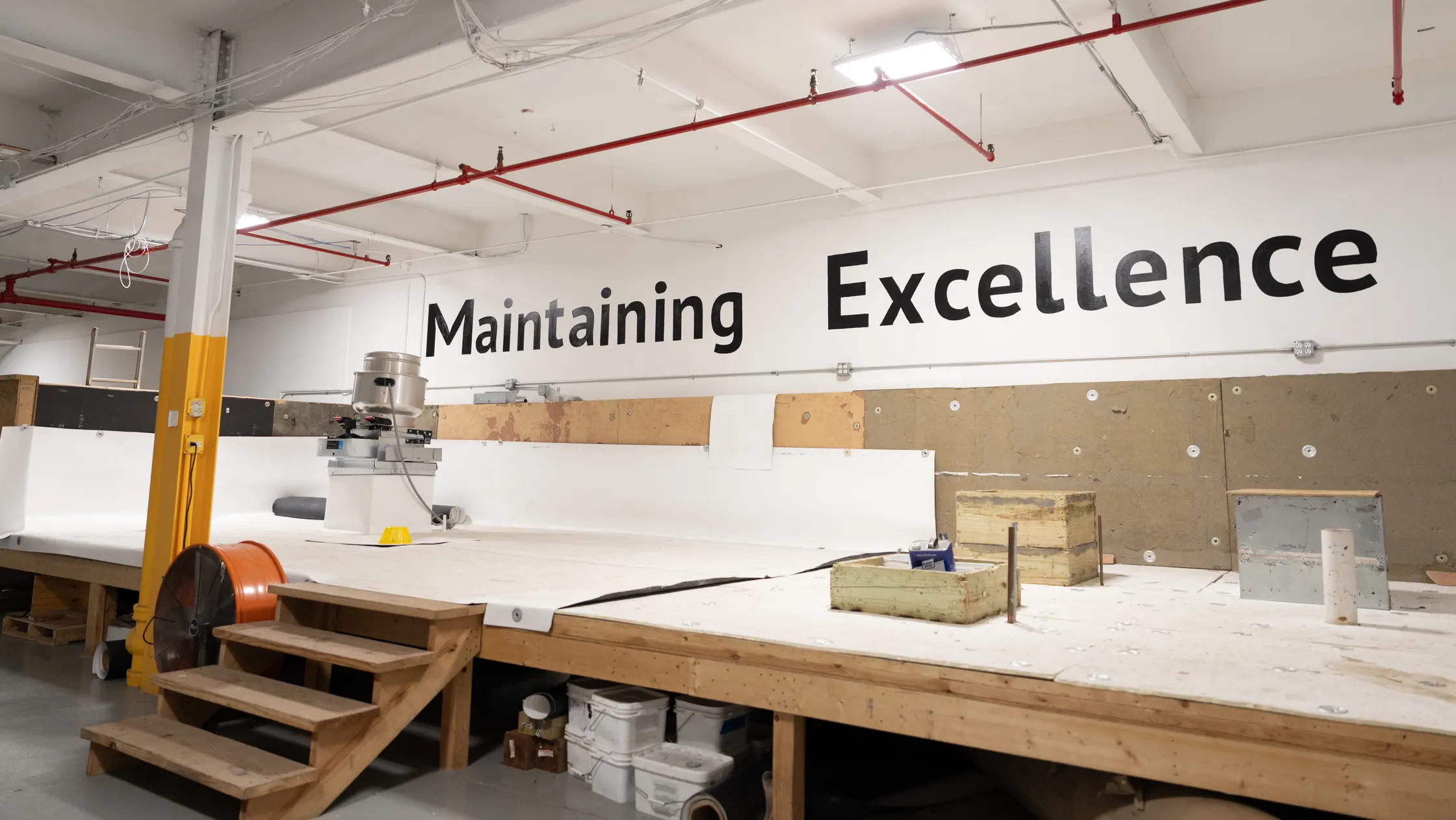 The training hall at headquarters, with Maintaining Excellence lettered on the wall