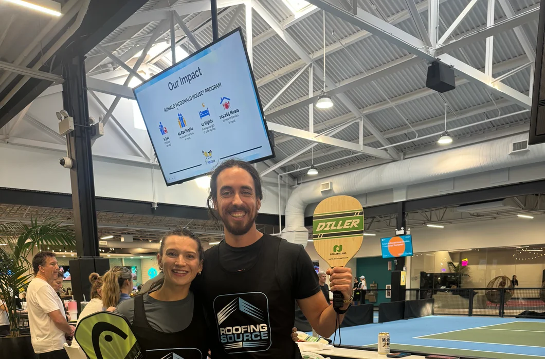 Two RoofingSource teammates at a company event