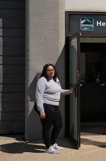 A RoofingSource teammate at the headquarters door