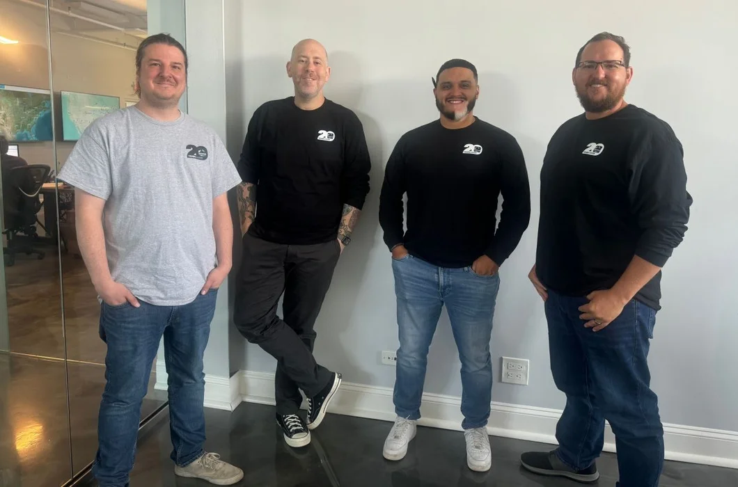 Four RoofingSource teammates at headquarters