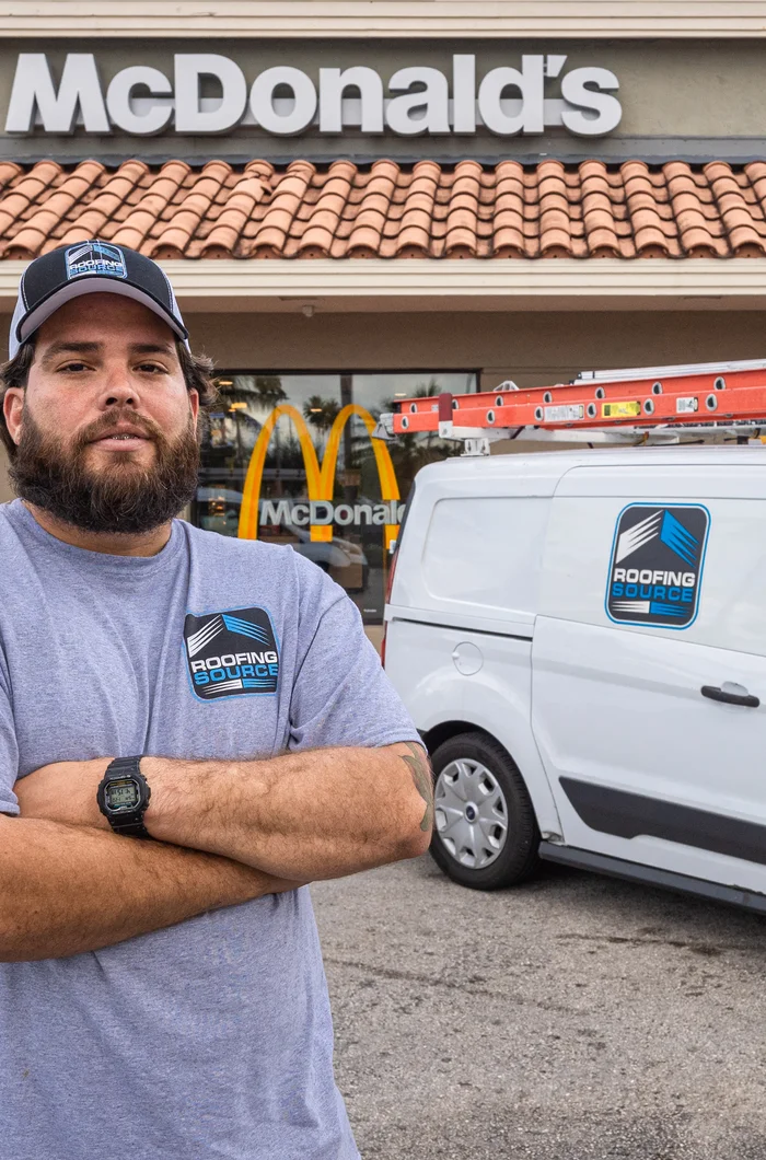 A Field Advisor beside his service van at a client restaurant